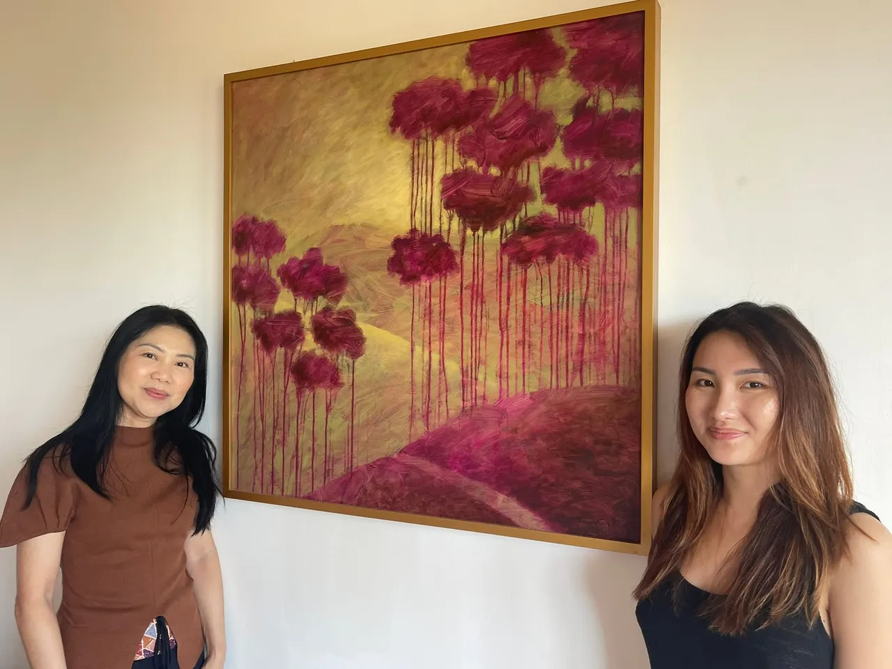 Guests beside a red poppy painting