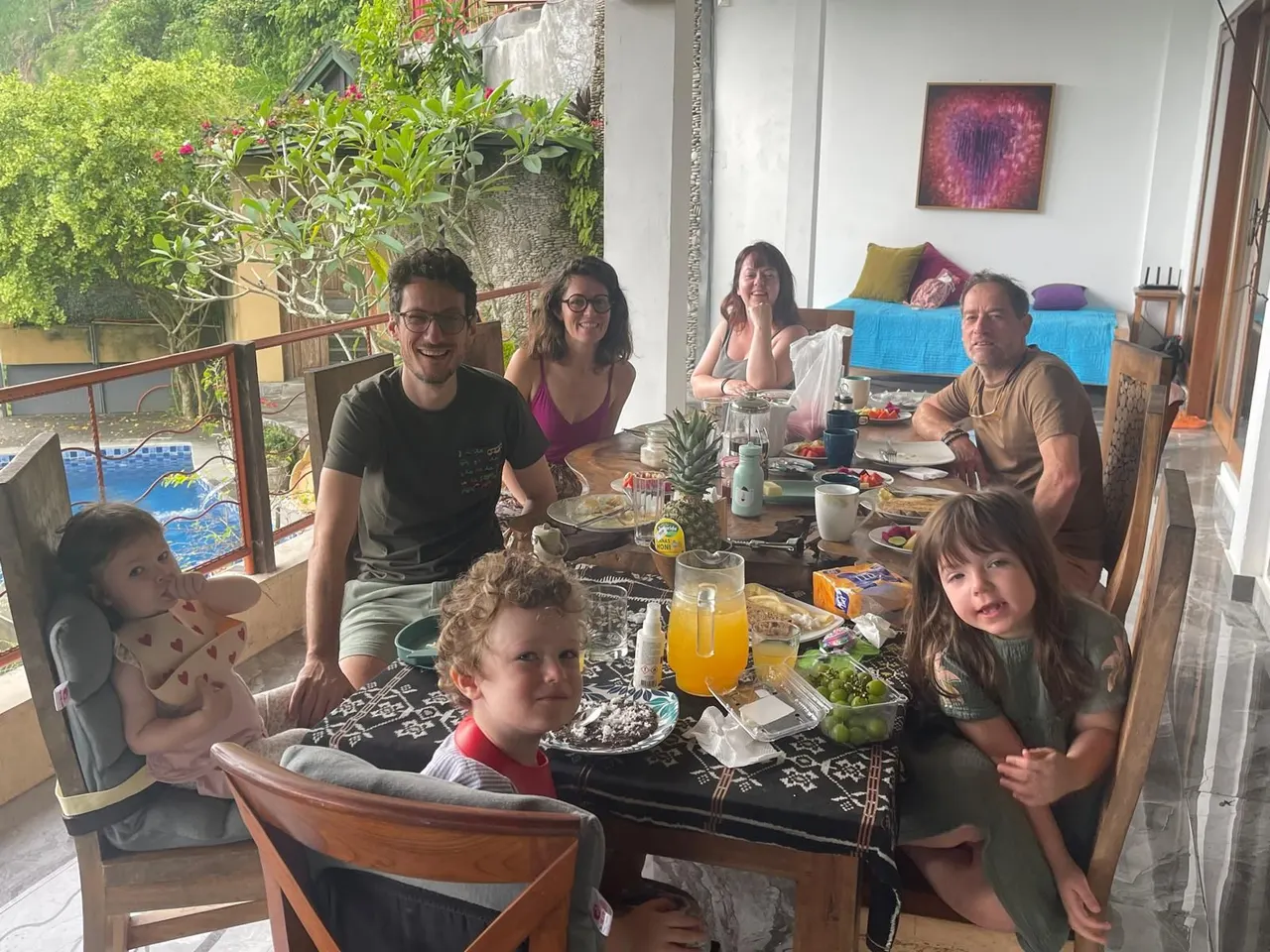 Family sharing a long lunch on the terrace