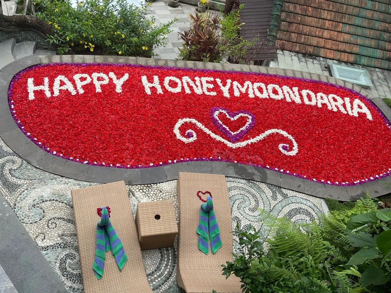 Happy honeymoon spelled in red petals