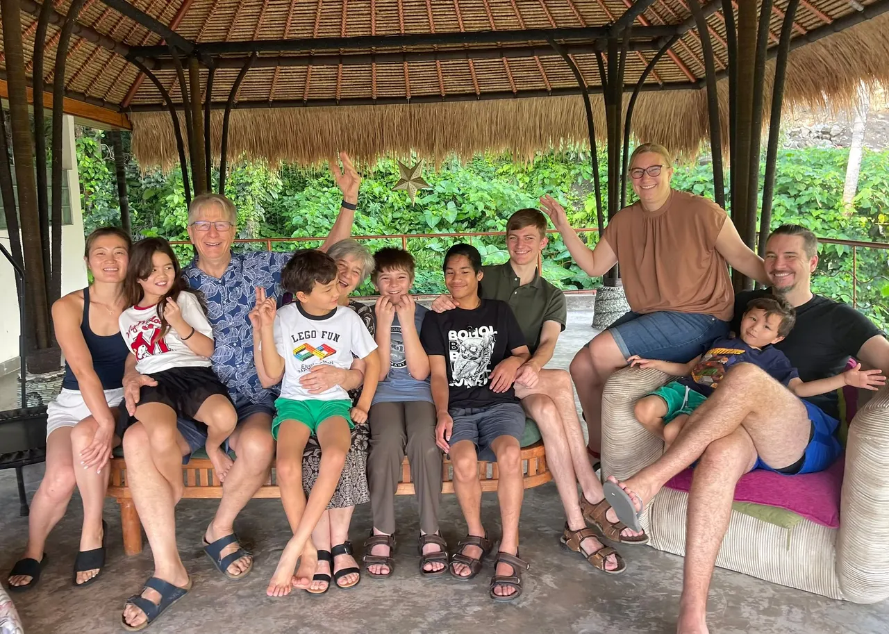 Multi-generation family gathered in the open-air bale