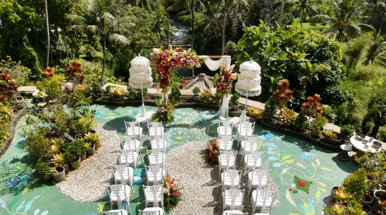 Poolside jungle wedding ceremony at River Song Bali