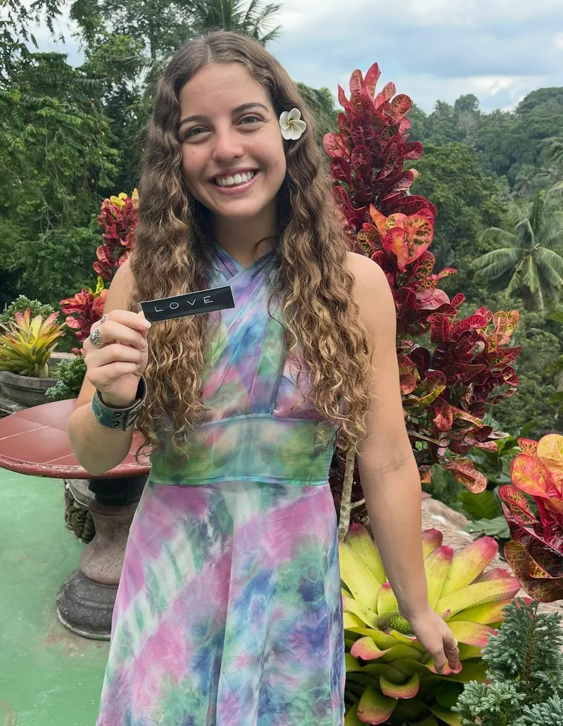 Guest smiling in the tropical garden