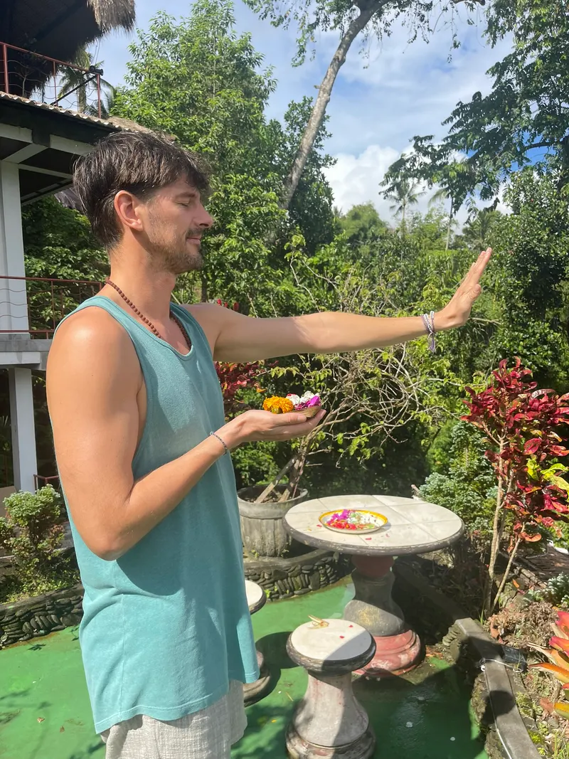 Guest placing an offering at the garden shrine