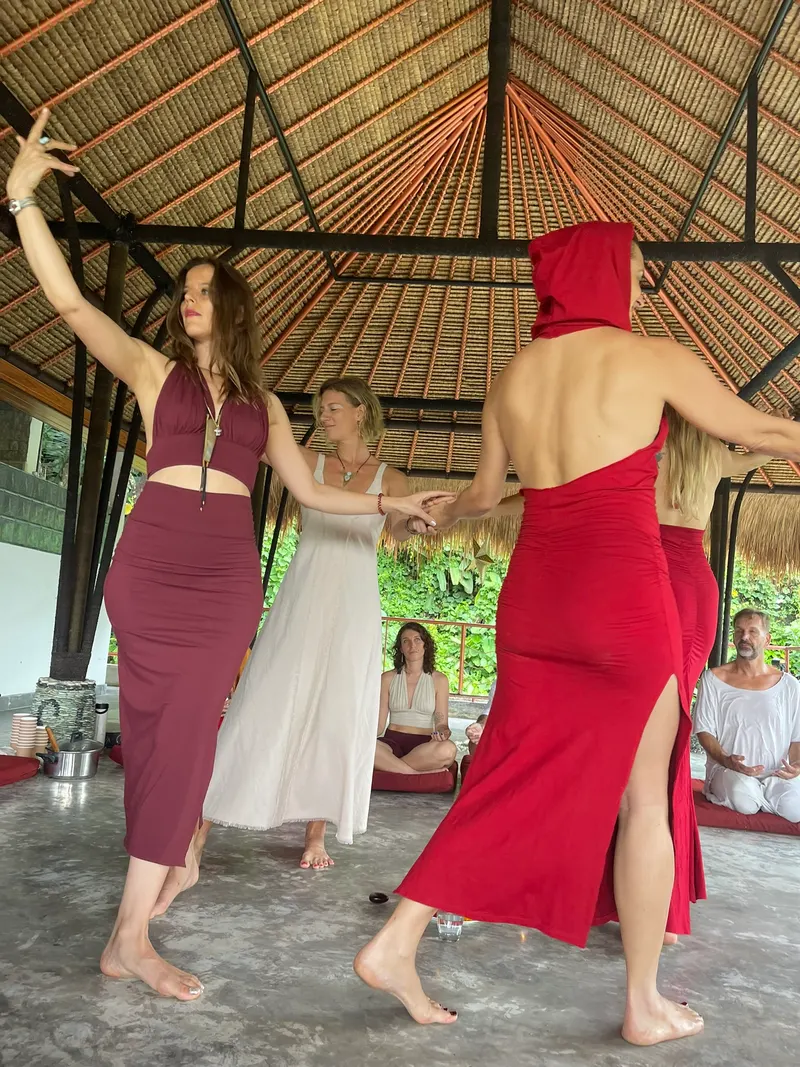 Guests moving through a dance session in the yoga shala